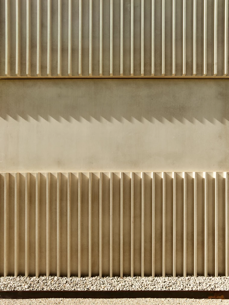 Detail of Big Field Housing's front with tinted prefabricated concrete FdMP architectes